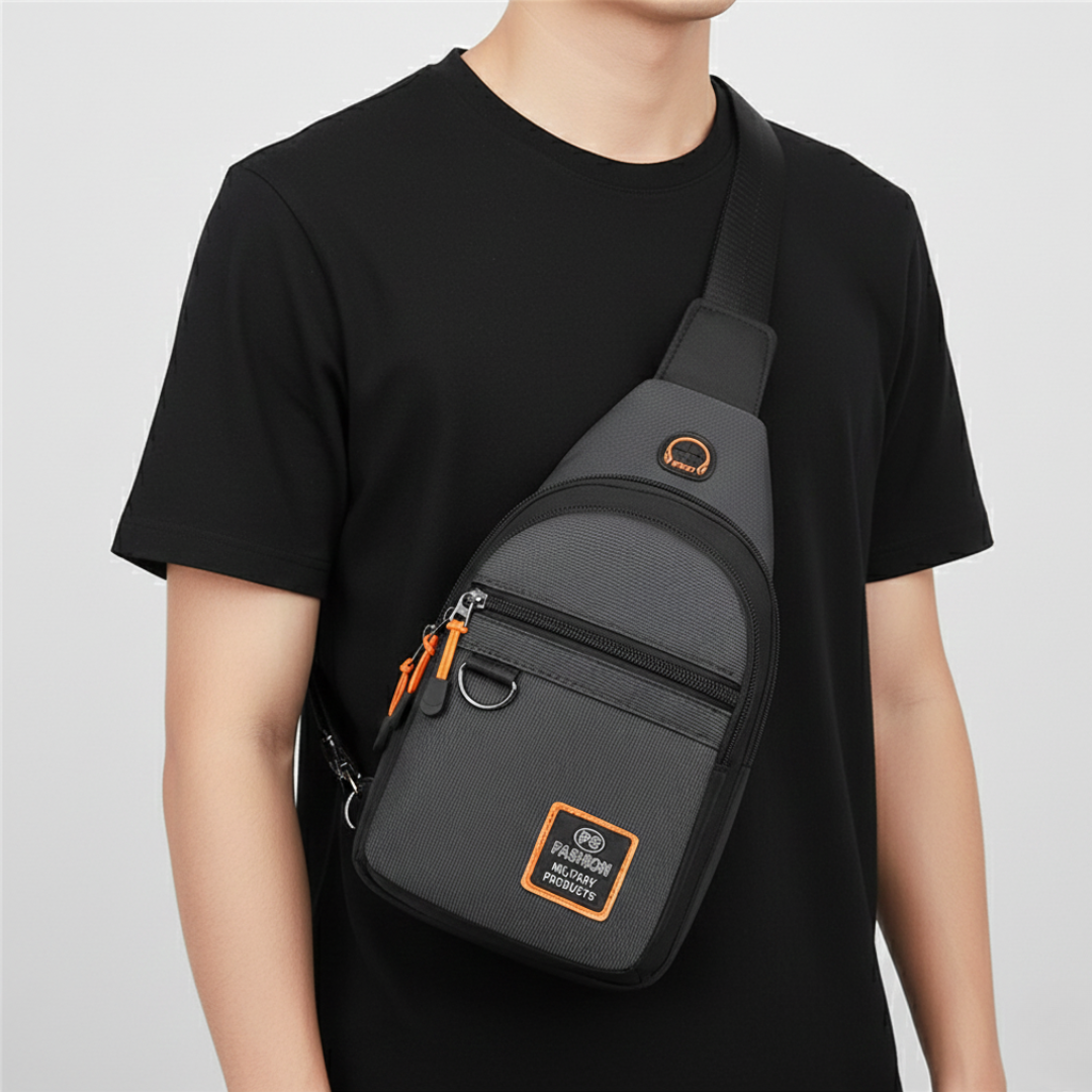 Man wearing a gray crossbody sling bag with multiple zippered compartments, adjustable shoulder strap, and compact everyday design.
